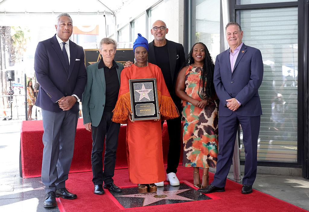 Angélique Kidjo poses with key people with her newly unveiled Hollywood Walk of Fame star in Los Angeles on August 18 2026