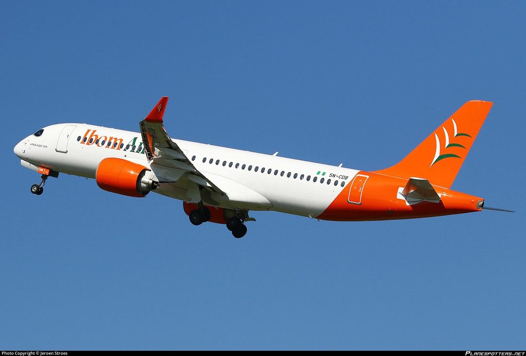Ibom Air Airbus A220-300 aircraft in the airline’s orange and green livery