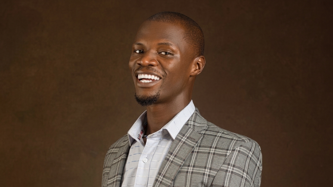 Nigerian gospel singer Toluwanisings, whose real name was Olayemi Bayonile Bolaji, in a grey plaid suit.